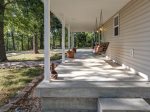 Covered front porch with a great swing.  Perfect for lake viewing and bird watching, reading and relaxing.